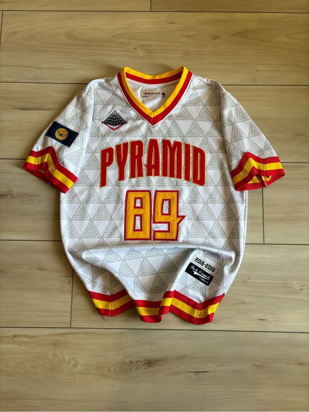 Black Pyramid Streetwear Chris Brown Retro White Jersey with Yellow and Red Trim